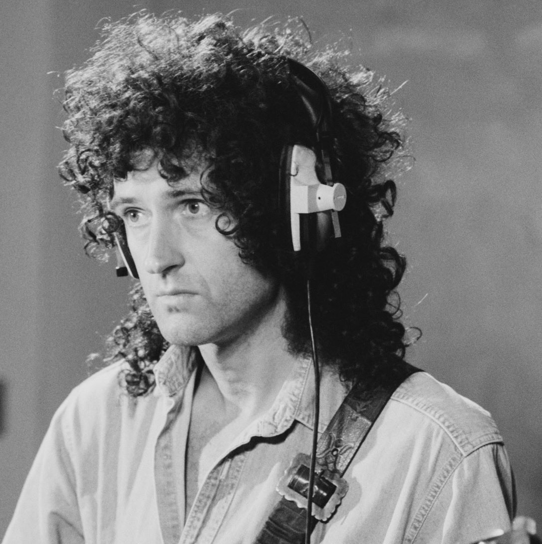 Brian May in studio 1970s, wearing headphones